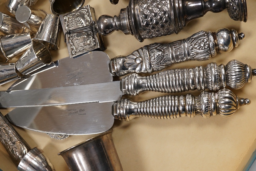 A pair of George V silver kiddush cups, maker M.S., London, 1919, 9cm, one other silver kiddush cup, two Judaic sterling tots, a set of eight Polish white metal tots, maker SJ, one other pair of Polish white metal tots,